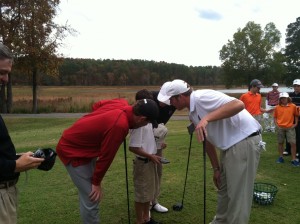 USC Golfers Matt Nesmith and Will Starke helpa Camper